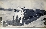 Postcard: Men Cleaning Snow Off the Rotary Equipment on a Locomotive