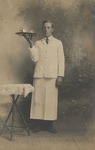 Postcard: Man in a Waiter Uniform Holding a Tray