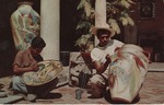 Postcard: Two Men Outside Painting Pottery