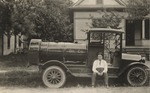 Postcard: Man Sitting on an Oil Truck