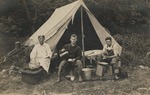 Postcard: Three Men and a Dog in Front of a Tent