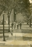 Professors and students walking east from the Memorial Union