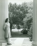 Woman Standing Next To Picken Hall Column