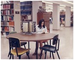 Woman Seated at Forsyth Library Periodical Index