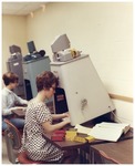 Woman Using Forsyth Library Microfilm Machine