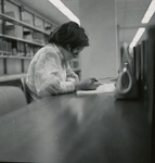 Woman Seated At a Forsyth Library Table