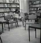 Woman Seated In The Forsyth Library Magazine Section
