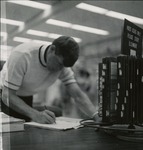 Man Taking Notes At The Forsyth Library Periodical Index