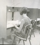Woman Sitting at a Forsyth Library Study Carrel