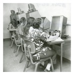 Four Women using Forsyth Library Microfilm Machines