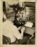 Print Shop Member Works at Typewriter