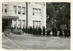 Graduates Walking into Sheridan Hall