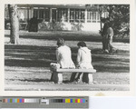Black-and-White Photograph of Two Women Sitting on a Bench in the Quad in 1978