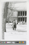 Black-and-White Photograph of Woman Walking on Campus Alone in the Snow in 1983