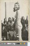 A Female Student Posing in Front of a Crowd