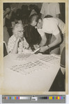 An Elderly Woman and Young Man at Event