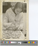 Female Student Working in Geology Lab.