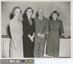 Three Women and One Man Pose for a Photo in Sheridan Coliseum