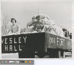 Three Women on a Truck Bed for a 50th Anniversary Parade Float for Wesley Hall at Fort Hays State College in 1952