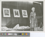 Woman Presenting Headshots of Presidents at the 75th Anniversary Exhibition