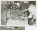 Woman Signing into the Fort Hays State University 75th Anniversary Event - 1977