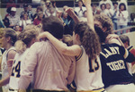 Team Cheering in a Group Hug by Fort Hays State University Athletics