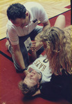 Sandra Norman and John Klein with Injured Deb Smith by Fort Hays State University Athletics