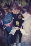 Angel Sharman Signs an Autograph