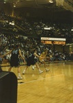 Player Dribbling Across Court by Fort Hays State University Athletics