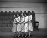 Women's Vocal Quartet Standing with Accompanist