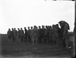 Men Lined Up at Experiment Station