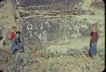 Boys Standing with the Buffalo Petroglyphs